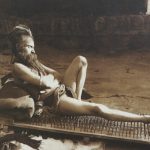 Fakir_on_bed_of_nails_Benares_India_1907
